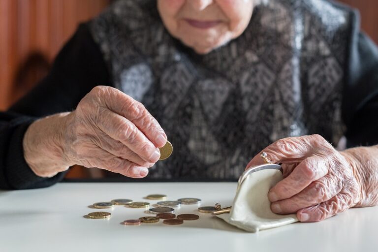 Elderly,95,Years,Old,Woman,Sitting,Miserably,At,The,Table