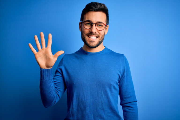 Young,Handsome,Man,With,Beard,Wearing,Casual,Sweater,And,Glasses