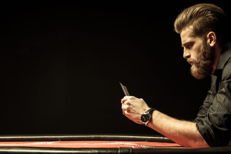 Side,View,Of,Bearded,Man,Holding,Poker,Cards,Isolated,On