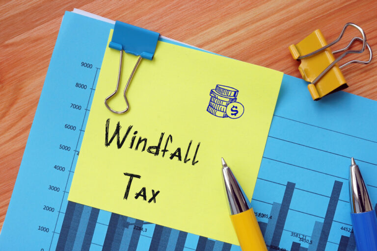 Financial,Concept,Meaning,Windfall,Tax,With,Sign,On,The,Sheet.