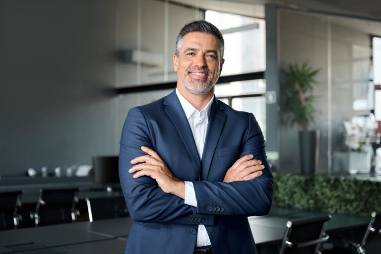 Happy,Mid,Aged,Business,Man,Ceo,Standing,In,Office,Arms