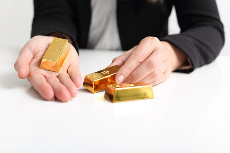 A,Business,Woman,Presents,Gold,Bullion,Bar