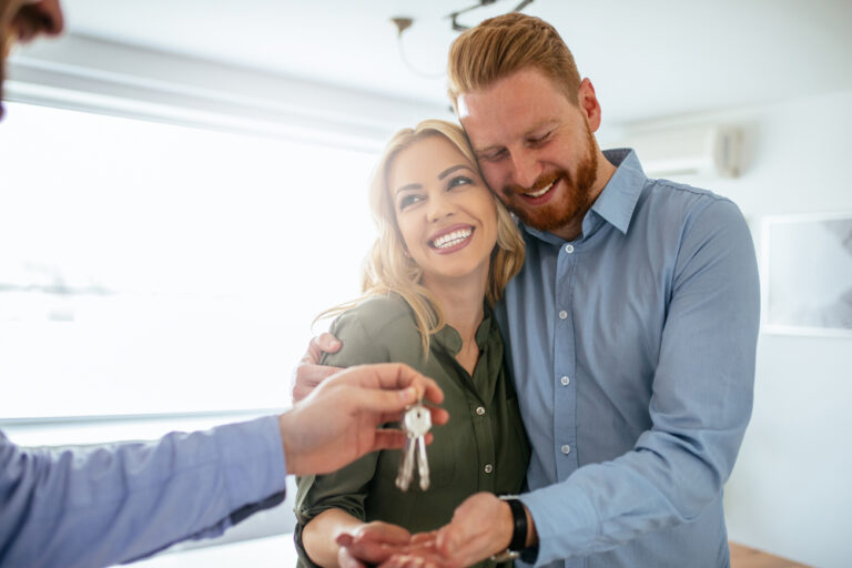 Happy,Couple,Moving,In,A,New,House.