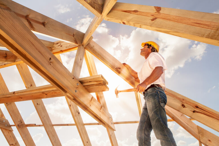 Worker,Roofer,Builder,Working,On,Roof,Structure,On,Construction,Site