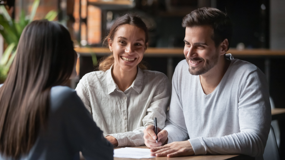 Happy,Young,Customers,Couple,Ready,To,Sign,Bank,Loan,Agreement