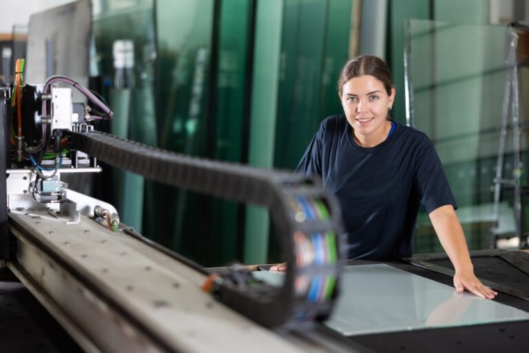 Skilled,Young,Female,Glass,Processing,Workshop,Worker,In,Blue,Uniform