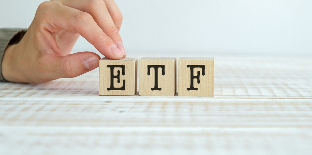 Exchange,Traded,Fund.,Wooden,Cubes,With,Etf,Text,And,Papers