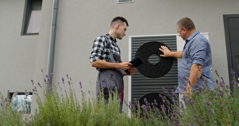 A,Technician,And,Homeowner,Discuss,Heat,Pump,Maintenance,,Referencing,A