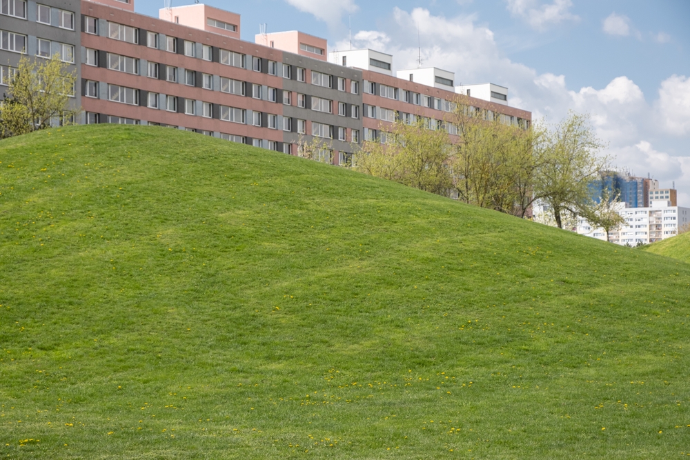 Spring,In,Prague,Public,Park,Against,Typical,Modern,Panel,Made